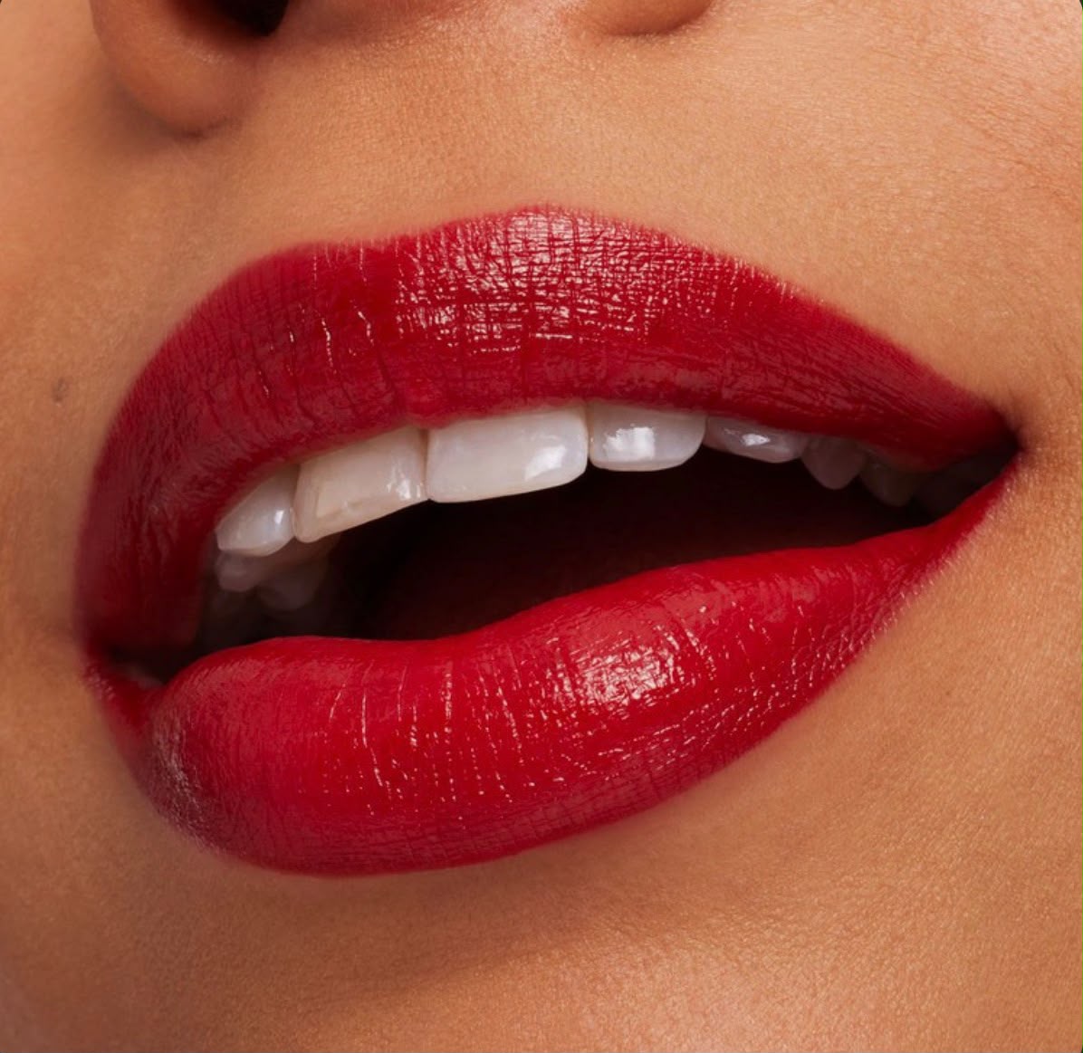 Close-up of a bold red matte lip