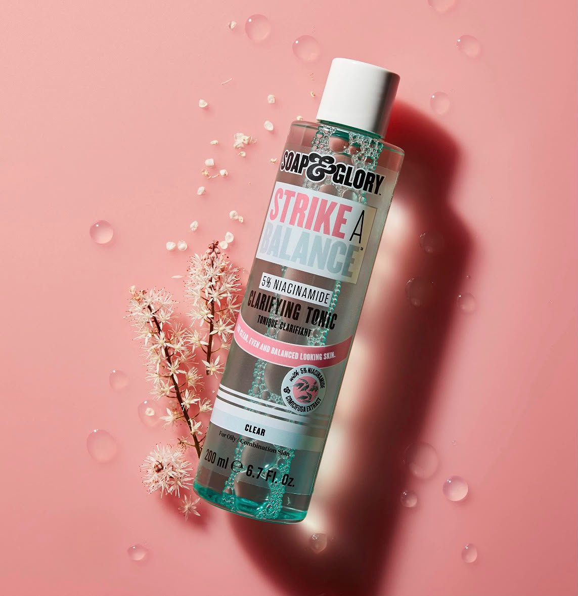 Soap & Glory Strike A Balance clarifying tonic bottle on a pink background