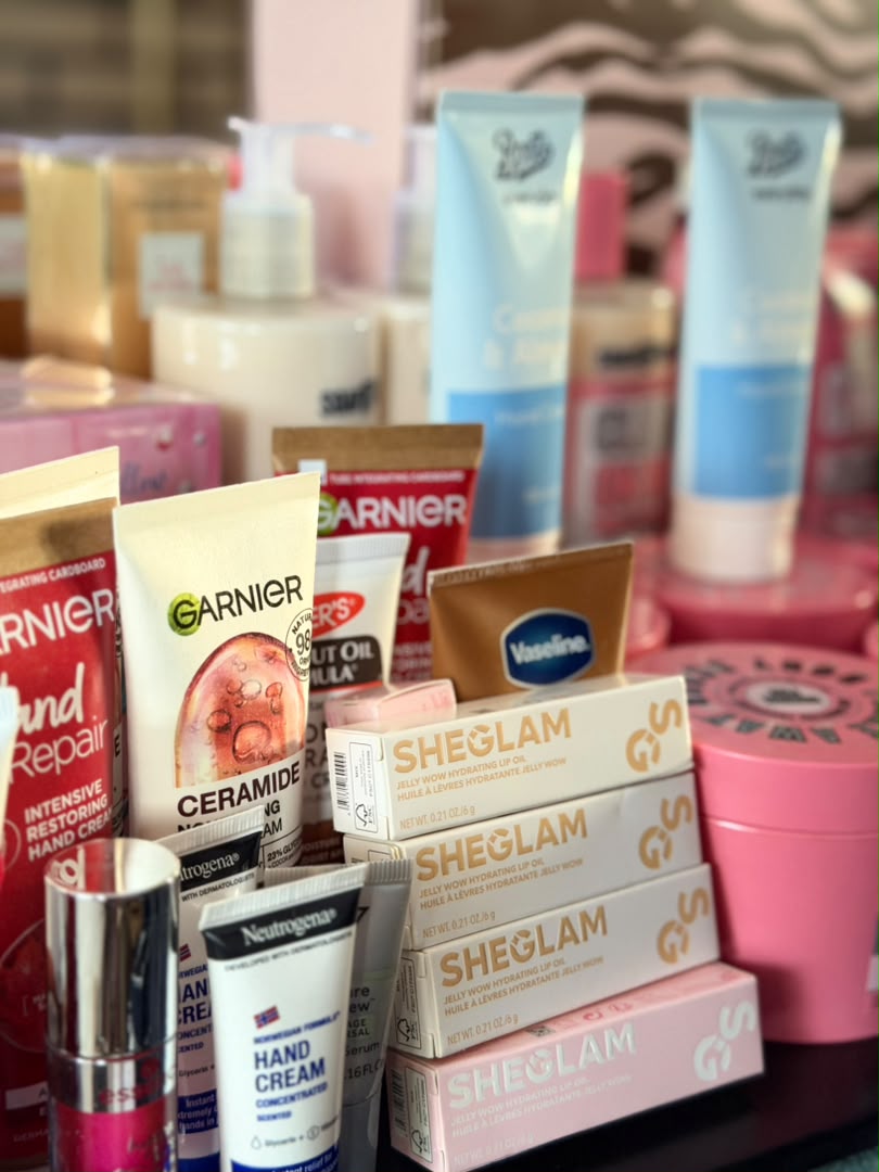 Hand creams, lip glosses and SHEGLAM makeup displayed in store